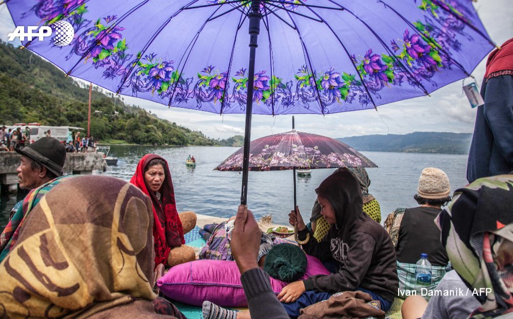 The captain of an overloaded Indonesian ferry that sank into a volcanic lake has been detained by police for questioning, as official estimates list 193 people still missing    