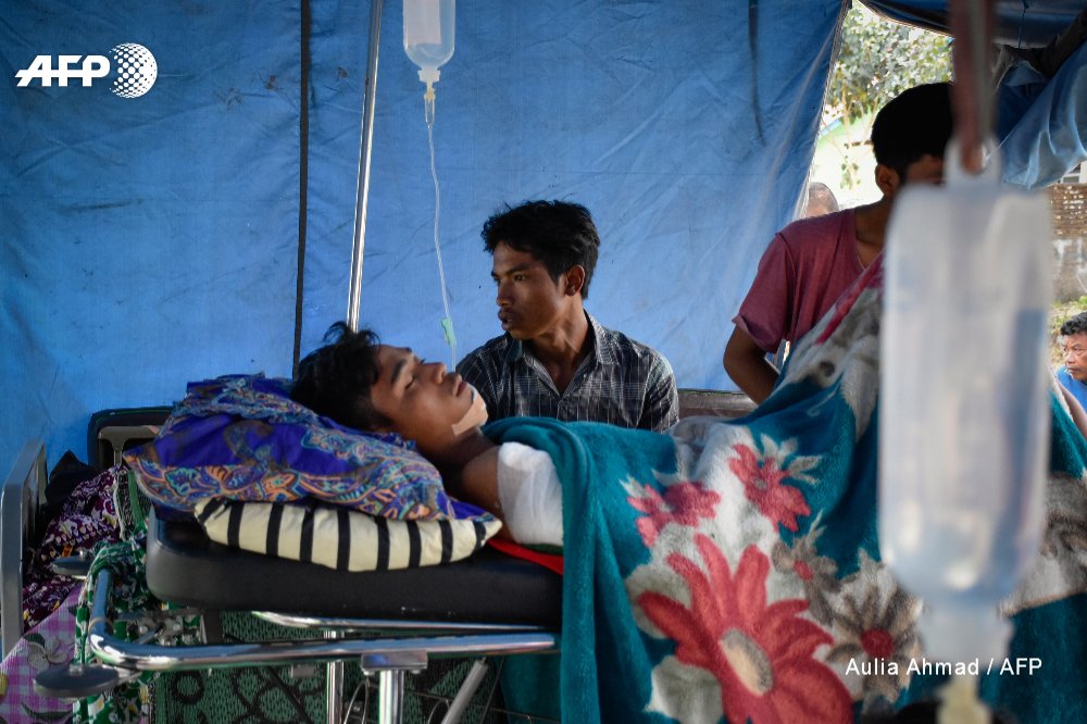 Indonesia mounts a rescue operation to reach more than 500 hikers and guides stranded by landslides on an active volcano on Lombok, a day after a powerful earthquake struck the area